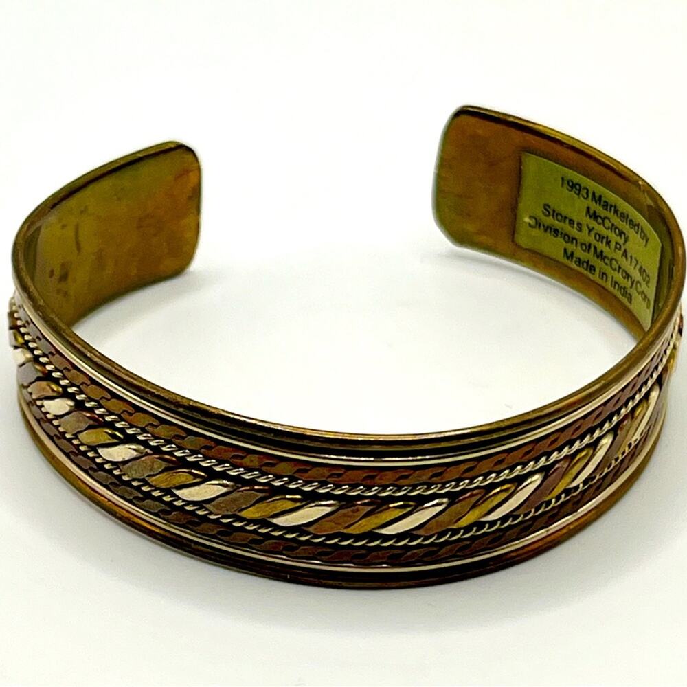 1993 brass and silver McCrory Stores cuff bracelet